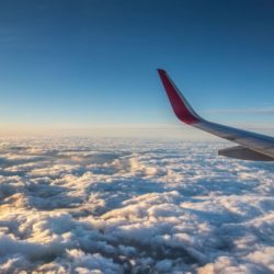 Airplane wings above the clouds